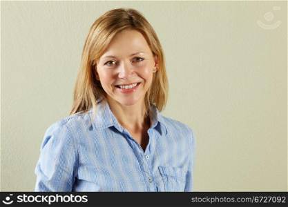 Studio Shot Of Relaxed Middle Aged Woman
