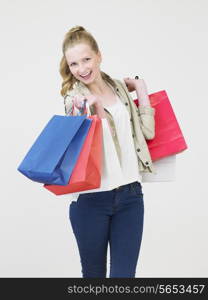 Studio Shot Of Teenage Girl With Shopping Bags