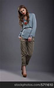Studio Shot of Trendy Fashion Model in Pants and Blouse