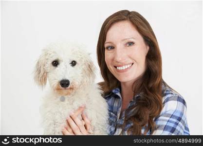 Studio Shot Of Woman With Pet Lurcher Dog