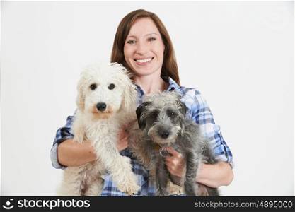 Studio Shot Of Woman With Two Pet Lurcher Dogs