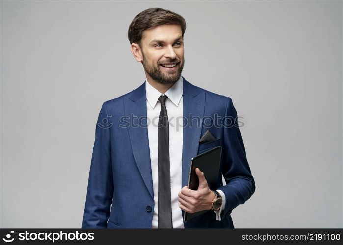 Studio shot of Young Businessman holding digital tablet pc pad with blank screen. Young Businessman holding digital tablet pc pad with blank screen