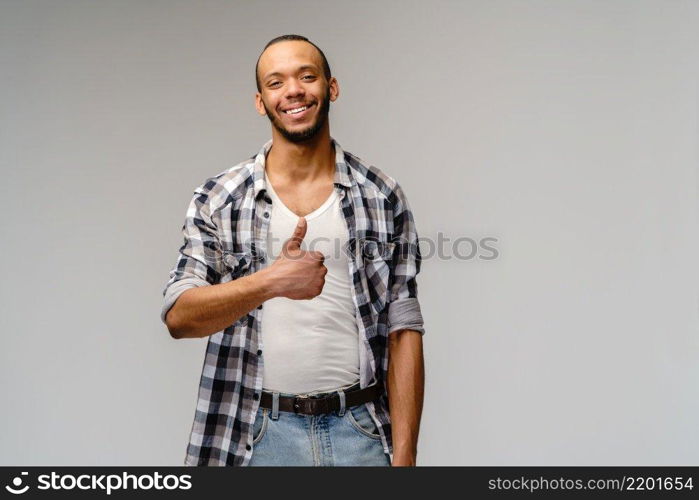 Studuo shot of thinking businessman wearing suit over grey background. Studuo shot of thinking businessman wearing suit