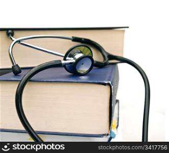 studying medicine or research book with stethoscope on white. books and stethoscope