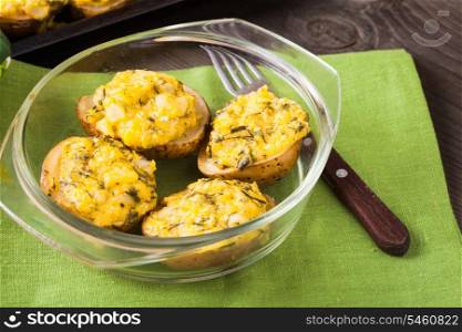 Stuffed baked potato with eggs, cheese and spices
