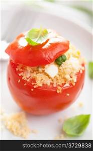 stuffed baked tomato with couscous and feta