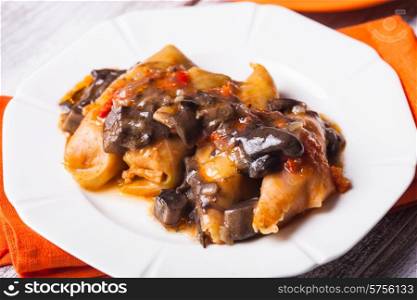 Stuffed cabbage with mushroom sauce on a plate