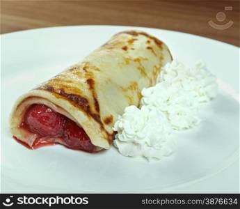 stuffed pancakes with raspberry jam and cream sauce