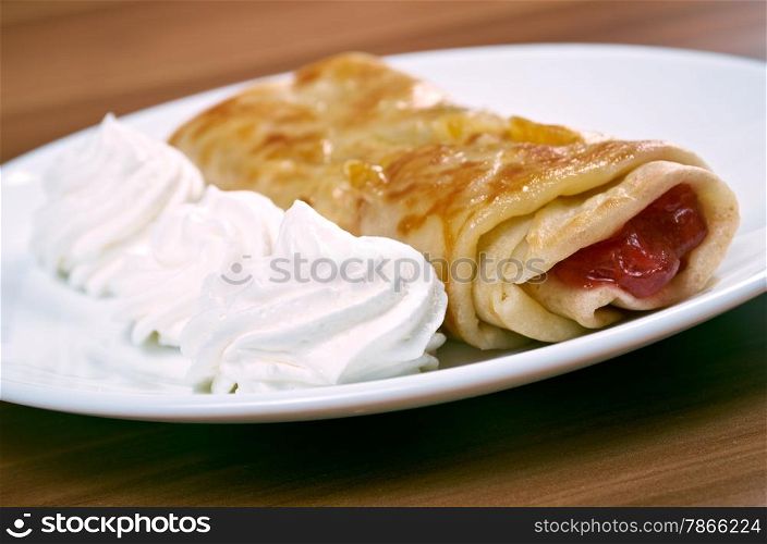 stuffed pancakes with raspberry jam and cream sauce