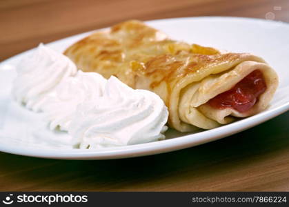 stuffed pancakes with raspberry jam and cream sauce