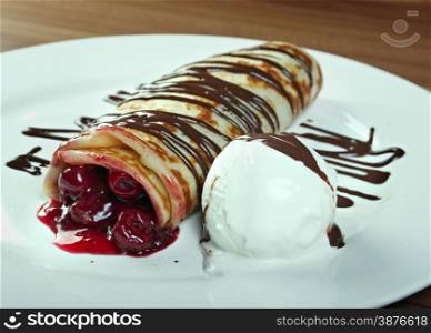 stuffed pancakes with with cherries and ice cream