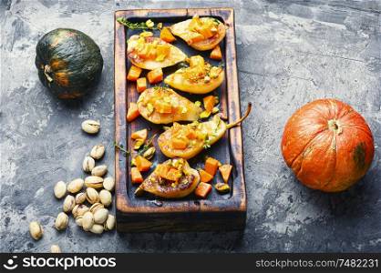 Stuffed pear pumpkin and pistachio. Baked pear. Autumn food.. Sweet baked pears