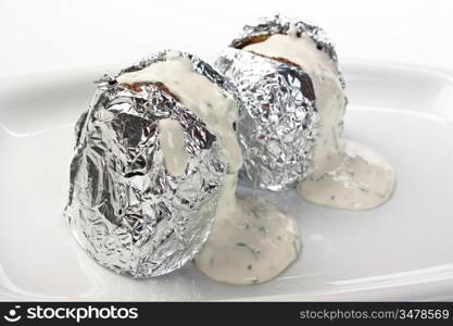 Stuffed potatoes in foil with spices