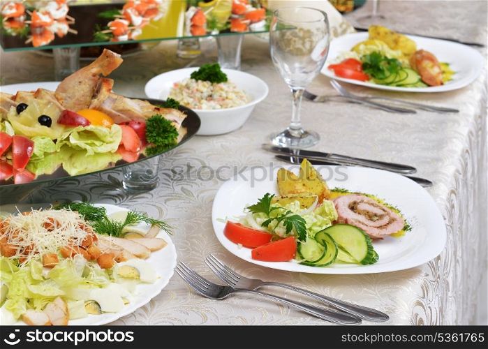 stuffed turkey fillet with potato and vegetables on table