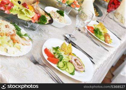 stuffed turkey fillet with potato and vegetables on table