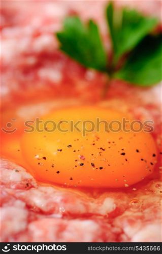 stuffing with egg close up yolk. Preparation of the meat rissoles
