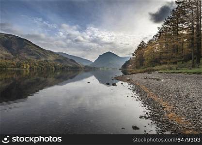 Stuning Autumn Fall landscape image of Lake Buttermere in Lake D. Beautiful Autumn Fall landscape image of Lake Buttermere in Lake District England