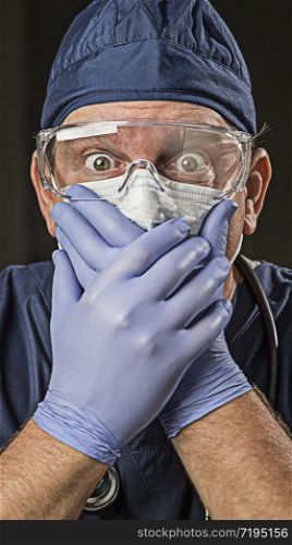 Stunned Male Doctor or Nurse with Protective Wear and Stethoscope.