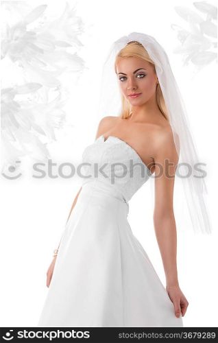 stunnig young woman with smooth hair in marriage day wearing white dress and veil. Some flower on background