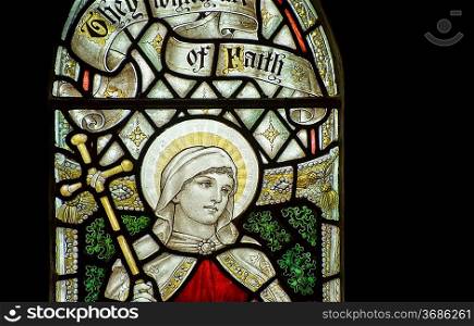 Stunning 15th Century stained glass window detail of Faith