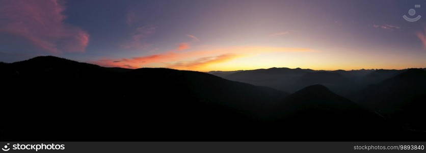 Stunning aerial mountain top sunrise