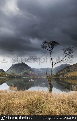 Stunning Autumn Fall landscape image of Lake Buttermere in Lake District England