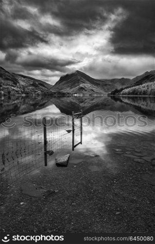 Stunning black and white Autumn Fall landscape image of Lake Buttermere in Lake District England