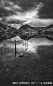 Stunning black and white Autumn Fall landscape image of Lake Buttermere in Lake District England