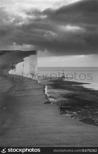 Stunning black and white landscape image of Beachy Headt lightho. Beautiful black and white landscape image of Beachy Headt lighthouse on South Downs National Park during stormy sky