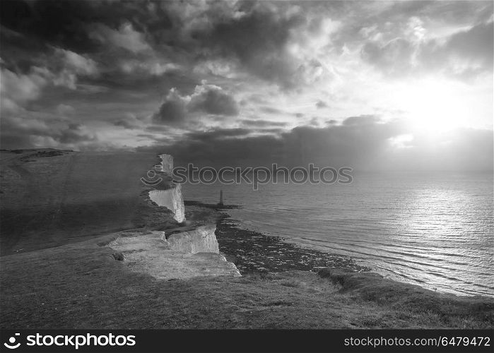 Stunning black and white landscape image of Beachy Headt lightho. Beautiful black and white landscape image of Beachy Headt lighthouse on South Downs National Park during stormy sky