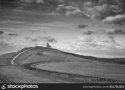 Stunning black and white landscape image of Belle Tout lighthous. Beautiful black and white landscape image of Belle Tout lighthouse on South Downs National Park during stormy sky