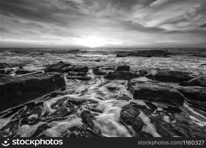 Stunning black and white seascape with the amazing sky over the water. Water motion blur