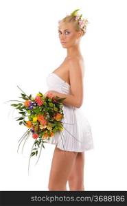 stunning blond girl in sexy white dress with flowers and bouquet as a spring woman