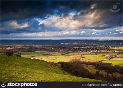 Stunning cloud formations during stormy sky over countryside landscape with vibrant colors