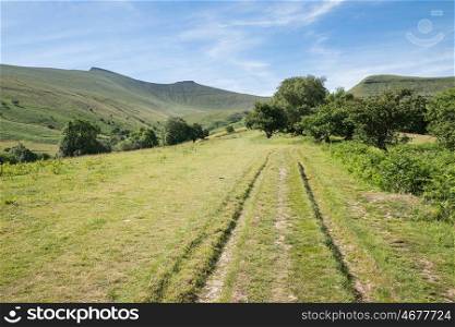 Stunning colorful Summer landscape of Brecon Beacons National Park looking down valley