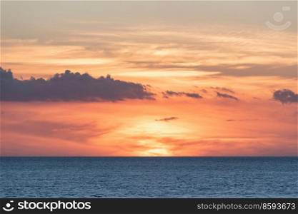 Stunning dramatic deep vibrant sunset over ocean landscape image 