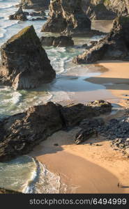 Stunning dusk sunset landscape image of Bedruthan Steps on West . Beautiful dusk sunset landscape image of Bedruthan Steps rock stacks on West Cornwall coast in England