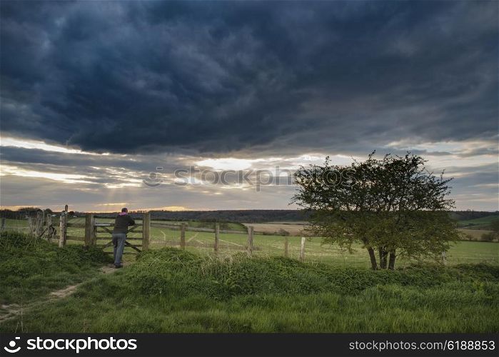 Stunning English countryside landscape over fields at sunset