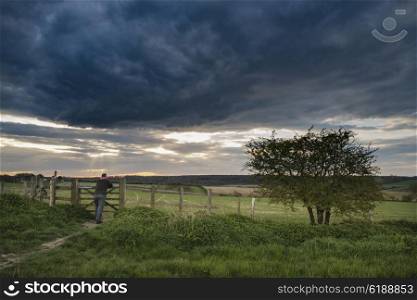 Stunning English countryside landscape over fields at sunset