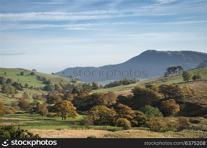 Stunning foggy Autumn Fall sunrise landscape image over countryside in Lake District in England