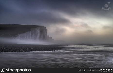 Stunning foggy Winter sunrise Seven Sisters cliffs landscape in England