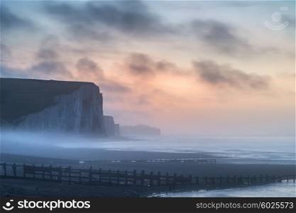 Stunning foggy Winter sunrise Seven Sisters cliffs landscape in England