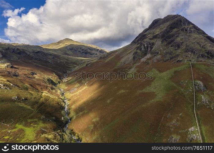 Stunning high point of view from flying drone over Lake District landscape in late Summer, in Wast Water valley with mountain views
