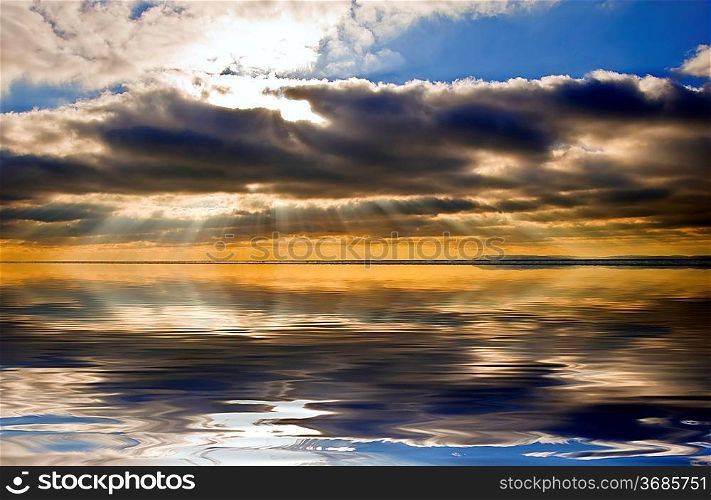 Stunning inspirational sunset image with glowing sun beams reflected in smooth simulated water