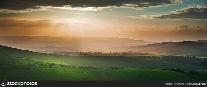 Stunning landscape at sunset over rolling English countryside