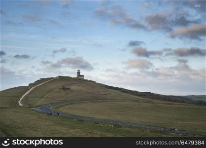 Stunning landscape image of Belle Tout lighthouse on South Downs. Beautiful landscape image of Belle Tout lighthouse on South Downs National Park during stormy sky