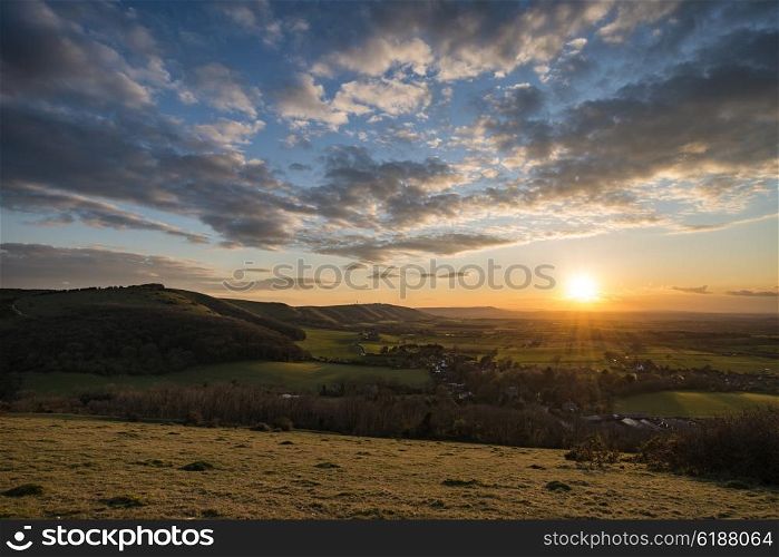 Stunning landscape image of sunset over countryside landscape in England