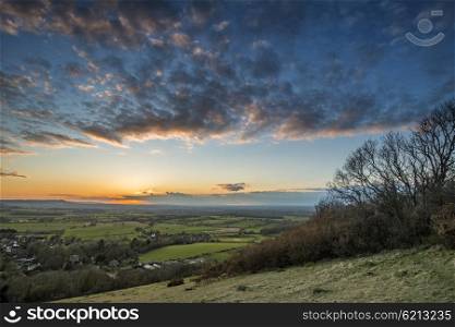 Stunning landscape image of sunset over countryside landscape in England