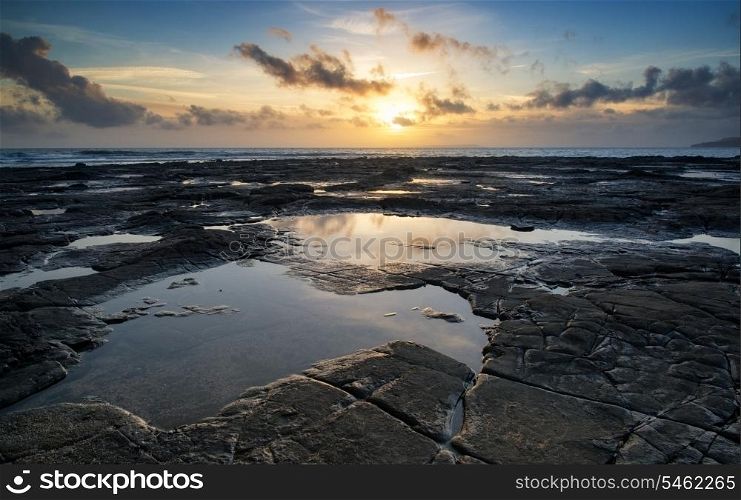 Stunning landscape ocean at sunset dramatic clouds