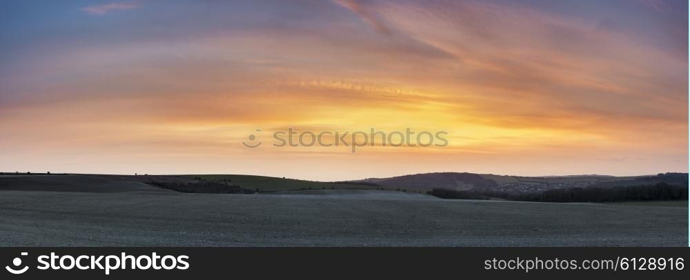 Stunning large panorama landscape of susnet over countryside